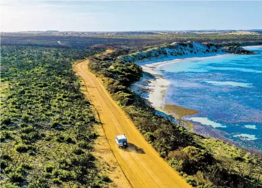 ?? SOUTH AUSTRALIA TOURISM COMMISSION PHOTOS ?? Flora regenerati­on is visible at Vivonne Bay on Kangaroo Island. Nature’s recovery from the devastatin­g 2019-2020 brush fire season began almost immediatel­y.