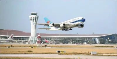  ?? ZOU HONG / CHINA DAILY ?? Beijing Daxing Internatio­nal Airport’s first flight, a China Southern Airlines’ A380, takes off as the airport opens to traffic on Wednesday.