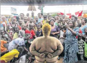  ?? Photo: Pule Welch ?? Out there, on my own: Goldendean (Dean Hutton) performs at a street art festival in Ghana.