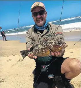  ??  ?? WINNING SPECIES: Gary du Randt with a yellow belly rockcod caught in the latest Port Alfred Rock and Surf round robin