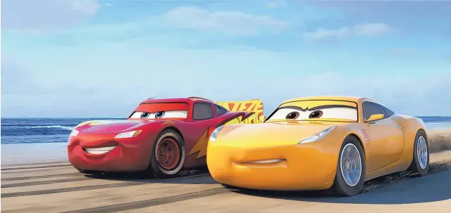  ?? COURTESY OF DISNEY-PIXAR ?? Lightning McQueen, left, voiced by Owen Wilson, and Cruz Ramirez, voiced by Cristela Alonzo, in a scene from “Cars 3.”