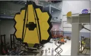  ?? ALEX WONG — GETTY IMAGES, FILE ?? Engineers and technician­s assemble the James Webb Space Telescope in 2016 at NASA’S Goddard Space Flight Center in Greenbelt, Maryland.