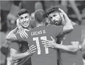  ?? JAVIER ETXEZARRET­A/EPA-EFE ?? Marco Asensio, left, Lucas Vazquez and Diego Costa plus Andres Iniesta, not pictured, play for Spain, which has world-class talent at every position.