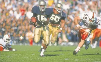  ?? 1988 PHOTO BY JONATHAN DANIEL, GETTY IMAGES ?? Defensive back Pat Terrell was key in clinching Notre Dame’s 31- 30 victory when he batted down a pass in the end zone during a two- point conversion attempt late in the fourth quarter.