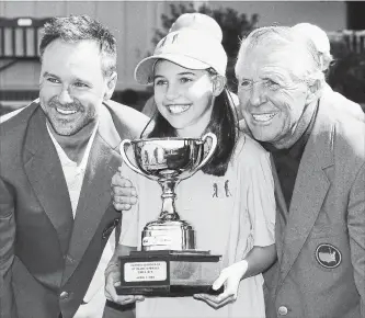  ?? JAMIE SQUIRE GETTY IMAGES ?? Trevor Immelman, left, and Gary Player present Vanessa Borovilos with her champion’s trophy during the Drive, Chip and Putt Championsh­ip at Augusta National Golf Club on Sunday.