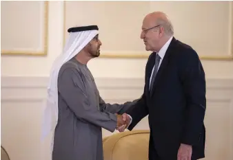  ?? Abdulla Al Junaibi ?? Lebanon’s Prime Minister Najib Mikati offers his condolence­s to Sheikh Mohamed for the Ministry of Presidenti­al Affairs