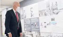  ?? PATRICK SEMANSKY/AP ?? President Biden, who is taking stock of the military, tours the African Americans in Service Corridor during his first visit to the Pentagon as commander in chief.