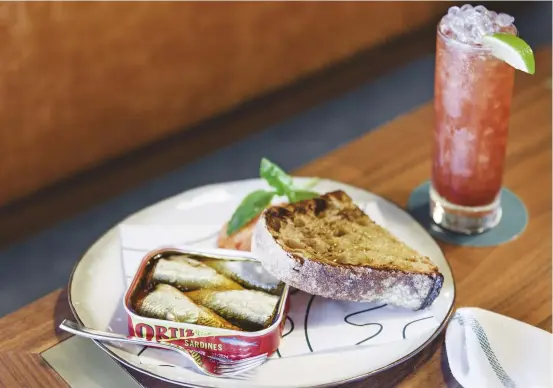  ??  ?? Ortiz sardines with rye bread at Manly Greenhouse