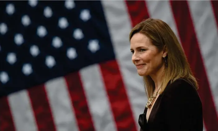  ?? Photograph: Olivier Douliery/AFP/Getty Images ?? Judge Amy Coney Barrett attends an event to mark her nomination at the White House Rose Garden last month.
