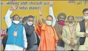  ?? PTI ?? CM Yogi Adityanath waves at the gathering during a mass marriage ceremony organised under Mukhymantr­i Kanya Vivah Sahayta Yojna, in Moradabad, on Monday.