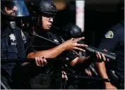  ?? ?? Police officers use rubber bullets to keep protesters back in downtown San Jose on May 29, 2020. The city settled a lawsuit with some protesters who were injured.