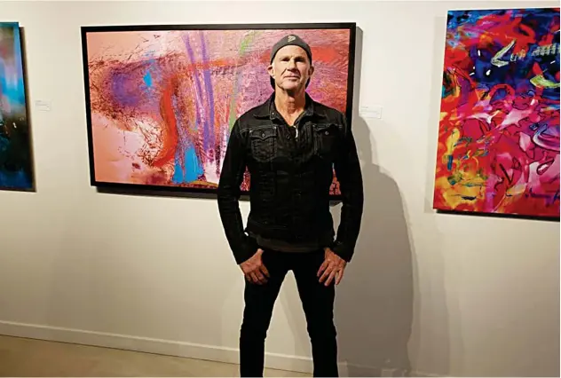  ??  ?? ↑
Top: Chad Smith stands by some of his completed works of art from ‘The Art of Chad Smith’ exhibit.