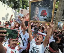  ?? PERAWONGME­THA Picture: REUTERS/ ATHIT ?? UP IN ARMS: Protesters hold up pictures of Aung San Suu Kyi during a demonstrat­ion to mark the second anniversar­y of Myanmar’s 2021 military coup, in Bangkok, Thailand, on Wednesday.