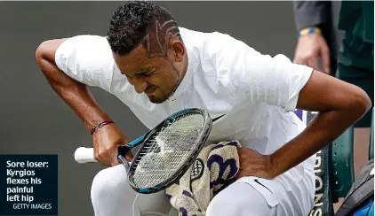  ?? GETTY IMAGES ?? Sore loser: Kyrgios flexes his painful left hip