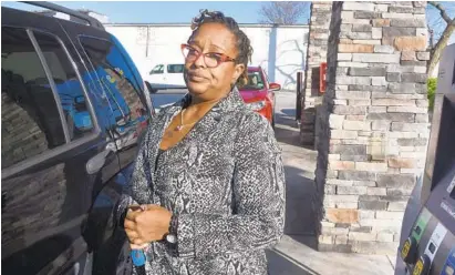  ?? BARBARA HADDOCK TAYLOR/BALTIMORE SUN PHOTOS ?? Ayana Malone, who lives in Hamilton, fills up her car last week at the Royal Farms on Russell Street. “I’ve been very curious as to why” gas prices have gone up recently, she said. “It’s odd that it’s going up so sharply.” Average prices have risen 18...