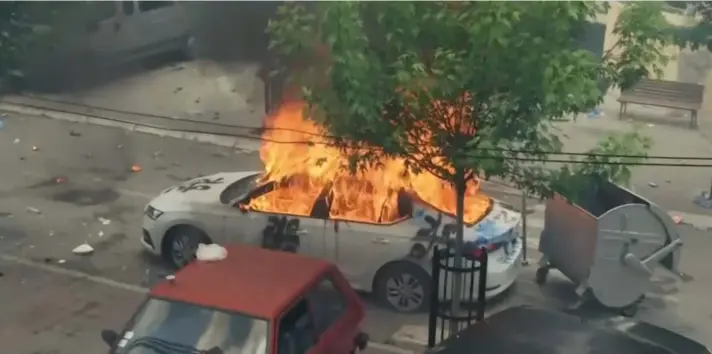  ?? ?? In this grab taken from video, a view of a car set on fire as KFOR soldiers clash with Kosovo Serbs in the town of Zvecan, northern Kosovo, Monday, May 29, 2023. Ethnic Serbs in northern Kosovo have clashed with troops from the NATO-led KFOR peacekeepi­ng force outside a municipal building. They were trying to take over one of the local government offices where ethnic Albanian mayors entered last week with the help of the authoritie­s. (AP Photo)