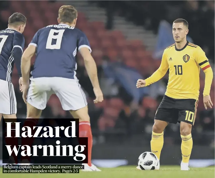  ??  ?? Belgium midfielder Eden Hazard takes on Scottish pair Callum Mcgregor, left, and Kevin Mcdonald during the visitors’ 4-0 win in last night’s friendly at Hampden. Hazard scored the second goal.