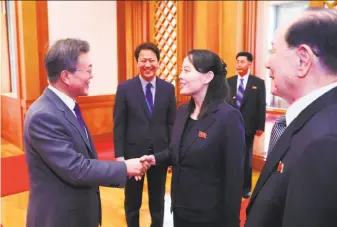  ?? AFP / Getty Images ?? South Korean President Moon Jae-in (left) greets Kim Yo Jong, North Korean leader Kim Jong Un’s sister, at their meeting in Seoul. Kim Jong Un invited Moon to visit the North for a summit.