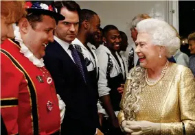  ??  ?? Beefed up: With the Queen at the 2012 Diamond Jubilee concert