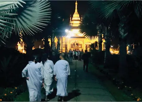  ??  ?? The Golden Pagoda in Namsai is home to Buddhist monks of all ages; ( left) a hanging bridge over the River Siang.