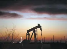  ?? SPENCER PLATT/GETTY IMAGES FILES ?? An oil pumpjack works at a Permian Basin oilfield in Andrews, Texas. In the energy sector, some of Canaccord’s top picks are CES Energy Solutions Corp. and Gran Tierra Energy Inc.