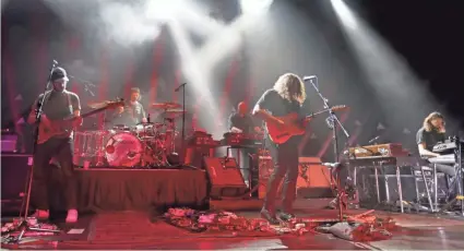  ?? SENTINEL MIKE DE SISTI, MILWAUKEE JOURNAL ?? The War on Drugs performs at a sold-out Riverside Theater in Milwaukee on Sunday.