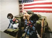  ?? ?? Service dogs being trained as part of the Tails of Valor program pile into a jeep during a tour of the General Carl Spaatz National USAAF Museum in Boyertown on Sept. 22.