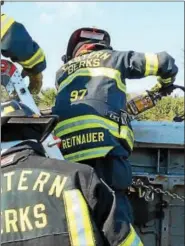  ?? COURTESY OF BASH CUB ?? Junior David Reitnauer goes through a training exercise with the Eastern Berks Fire Company.