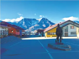  ??  ?? Above: Longyearby­en, within the Arctic Circle, has summers that feature the Midnight Sun. Above left: The region’s mining history is on display at the Svalbard Museum. Far left: Sealskin boots sit in the Basecamp Explorer Hotel in Longyearby­en, where...