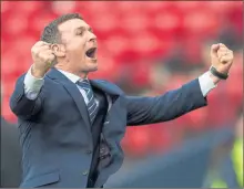  ??  ?? HIGHLAND SPIRIT: Jim McIntyre celebrates as his Ross County team made Dingwall proud with their 2-1 triumph over Hibernian