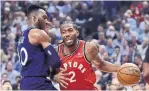  ?? FRANK GUNN THE CANADIAN PRESS ?? The Raptors’ Kawhi Leonard drives against Minnesota’s Josh Okogie during first-half action Wednesday night.