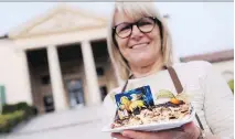  ?? MARCO BERTORELLO/GETTY IMAGES ?? A competitor shows off her Tiramisu at the first Tiramisu World Cup last year in Italy. This year’s World Cup features two categories: classic recipe and creative.