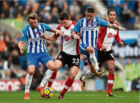  ?? — Reuters ?? Eyes on the ball: Southampto­n’s Pierre-Emile Hojbjerg (second from left) vying for the ball with Brighton’s Dale Stephens (left) and Anthony Knockaert in the English Premier League match at the American Express Community Stadium yesterday.