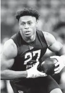  ?? CHARLIE NEIBERGALL/AP ?? Wisconsin running back Jonathan Taylor runs a drill at the NFL scouting combine in Indianapol­is on Feb. 28.