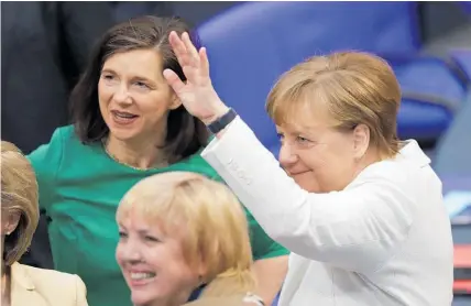  ?? Picture / AP ?? German Chancellor Angela Merkel waves as she arrives in Germany's Parliament last night where she was to be elected for a fourth term.