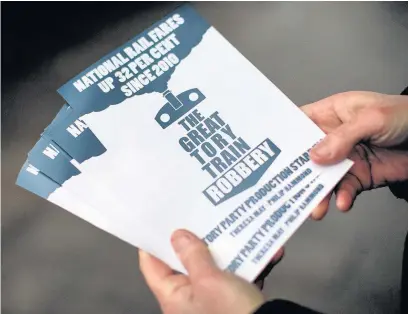  ?? JACK TAYLOR ?? Campaigner­s against rail fare increases have been handing out leaflets at train stations across the UK