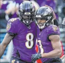  ?? Nick Wass The Associated Press ?? The Ravens’ Lamar Jackson, left, is ninth in the NFL in passing yards and sixth in rushing yards. No quarterbac­k has finished in the top 10 in both since Randall Cunningham in 1990.