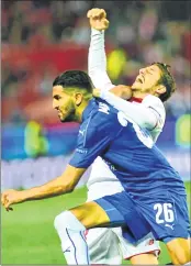  ??  ?? Leicester City's Algerian midfielder Riyad Mahrez (L) vies with Sevilla's defender Sergio Escudero (R) during the UEFA Champions League round of 16 second leg football match at the Ramon Sanchez Pizjuan stadium in Sevilla.