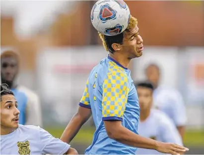  ?? DOUG KAPUSTIN/BALTIMORE SUN MEDIA GROUP ?? River Hill’s Jed Dixon gets control with a header over Oakland Mills’ Geo Estrada in the first half of the Hawks’ 4-0 victory.