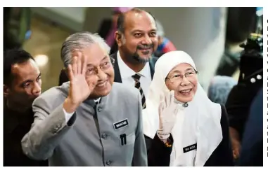  ??  ?? Common goal: Dr Mahathir with Deputy Prime Minister Datuk Seri Dr Wan Azizah Wan Ismail and Communicat­ions and Multimedia Minister Gobind Singh Deo after the Prime Minister gave an address for the one-year anniversar­y of the Pakatan Harapan government in Putrajaya, 2019.