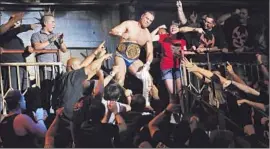  ?? Francine Orr Los Angeles Times ?? JOSE ALBERTO RODRIGUEZ, who competes as Alberto El Patron, greets a Boyle Heights crowd at a match. “Here it’s all about the Latin culture,” he says.