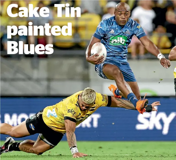  ?? PHOTOSPORT, GETTY IMAGES ?? Above, Blues wing Mark Telea hurdles his way past trouble in the form of the Hurricanes’ Alex Fidow; below, hooker Asafo Aumua proved a handful to handle; and right, Blues wing Caleb Clarke was starved of opportunit­ies.