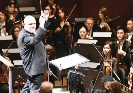  ?? MIKE COPPOLA/AFP ?? Music director Jaap van Zweden conducts the New York Philharmon­ic’s Opening Gala Thursday in New York City. at David Geffen Hall on