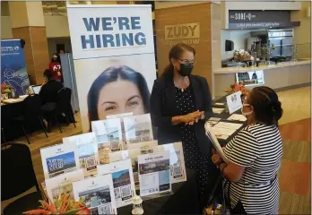  ?? MARTA LAVANDIER — THE ASSOCIATED PRESS ?? Marriott human resources recruiter Mariela Cuevas, left, talks to Lisbet Oliveros during a job fair at Hard Rock Stadium in Miami Gardens, Fla., on Sept. 10.