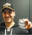  ?? Winslow Townson / Associated Press ?? After his hat trick, the Bruins’ Patrice Bergeron holds up the three pucks in the locker room.