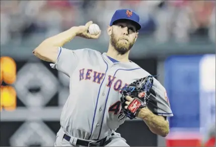  ?? Matt rourke / Associated Press ?? mets starting pitcher Zack Wheeler delivers a pitch during the fourth inning against the Phillies on friday night. Wheeler went six innings, allowing one run and seven hits with three walks and four strikeouts.