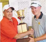  ?? ADOLPHE PIERRE-LOUIS/JOURNAL ?? Veteran Journal writer Mark Smith, left, presents Men’s City Golf Amateur champion Patrick McCarthy the trophy after Sunday’s play. The trophy was named after Smith in 2014.