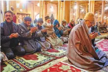  ?? ANI ?? Muslims offer the afternoon prayers at Jamia Masjid after it was opened for the public after four-and-a-half months in Srinagar yesterday.