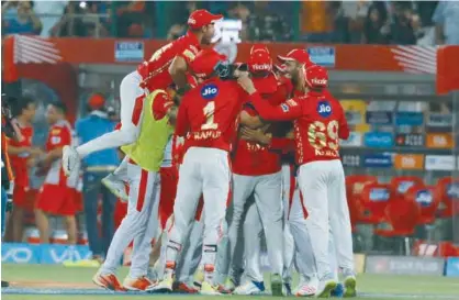  ??  ?? Kings XI Punjab players celebrate after their win over Delhi Daredevils in their IPL match at the Feroz Shah Kotla Ground in Delhi on Monday.