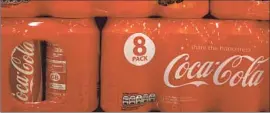  ?? Paul Thomas Bloomberg ?? IN ONE TELEVISION AD, COCA-COLA said that since 2004 it has helped reduce the calorie count 90% in drinks available in the schools it serves.